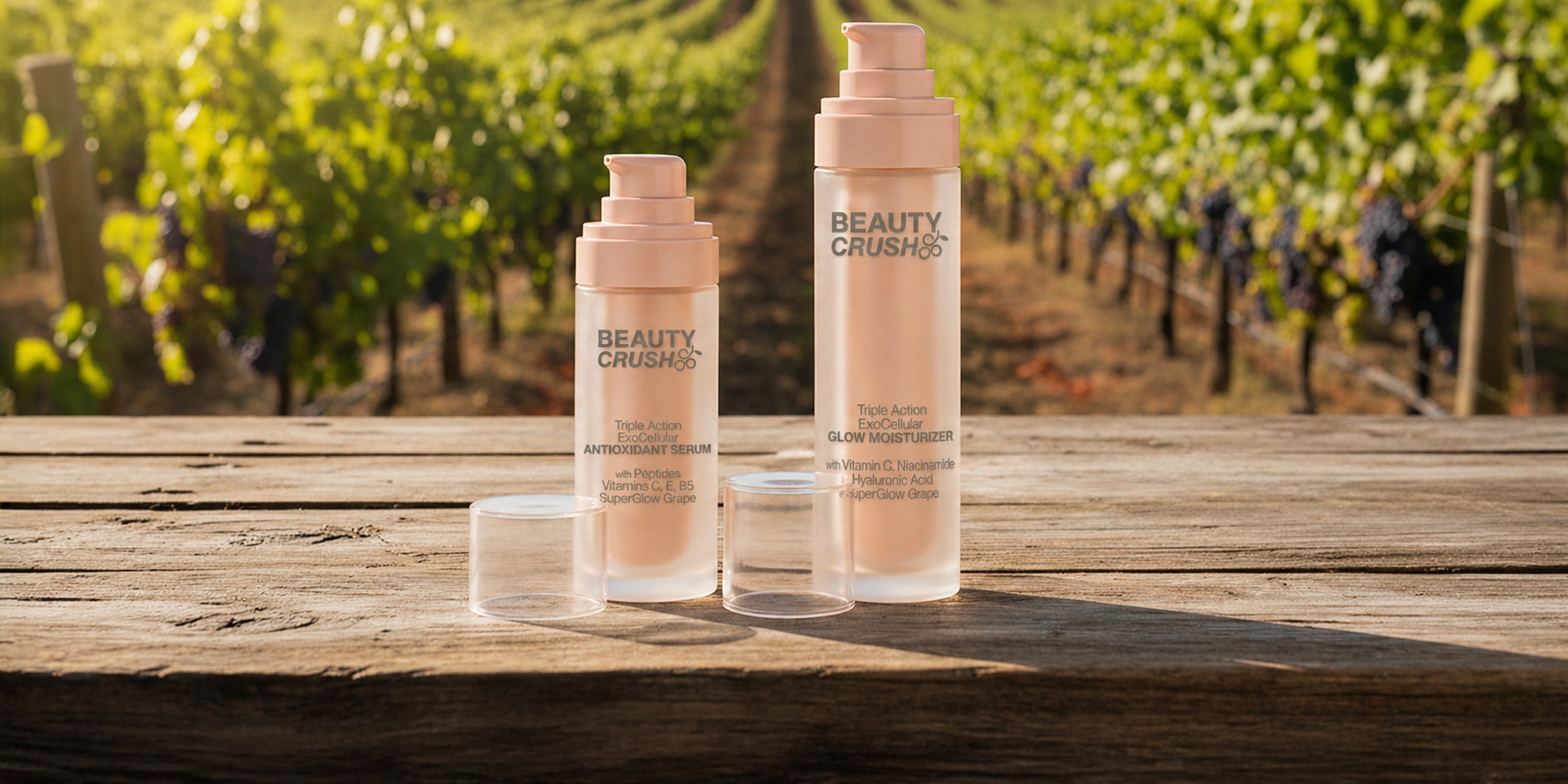 Two bottles of 'Beauty Crush' products on a wooden table with a vineyard background